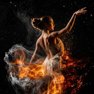 Surreal fine art image of a ballerina surrounded by fire and smoke against a dark starry background.
